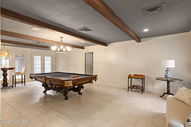 207 Beverly Dr, Lafayette, LA 70503 - rec room with beamed ceiling, pool table, a textured ceiling, baseboards, and french doors