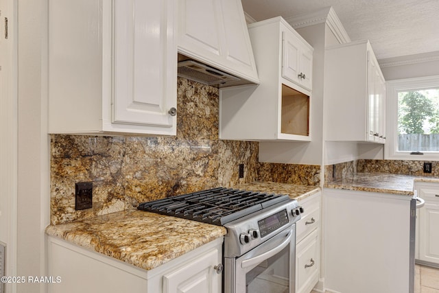 207 Beverly Dr, Lafayette, LA 70503 - kitchen with stainless steel gas range, ornamental molding, white cabinets, tasteful backsplash, and light stone counters