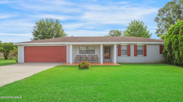 114 Marina Loop, Scott, LA 70583 - ranch-style house featuring covered porch, an attached garage, driveway, and a front yard