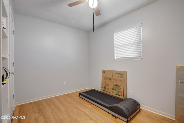 114 Marina Loop, Scott, LA 70583 - exercise area with wood finished floors, ceiling fan, and baseboards