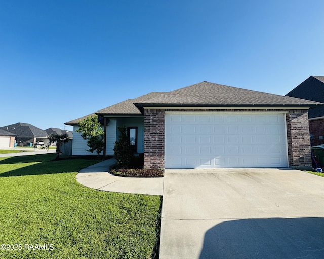 view of front of house with driveway, brick siding, a front yard, a garage, and a shingled roof