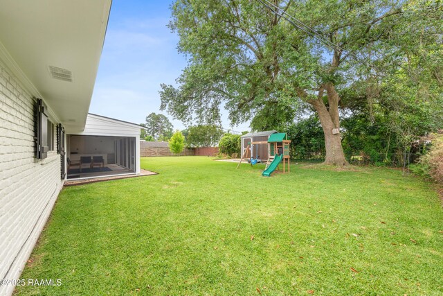 436 Brentwood Blvd, Lafayette, LA 70503 - view of yard featuring a playground and a sunroom