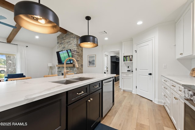 436 Brentwood Blvd, Lafayette, LA 70503 - kitchen featuring stainless steel dishwasher, a sink, white cabinetry, range, and light wood-style flooring