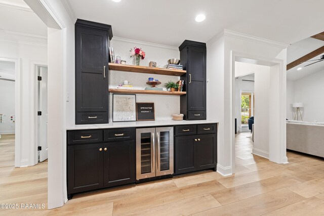 436 Brentwood Blvd, Lafayette, LA 70503 - bar area featuring beverage cooler, crown molding, recessed lighting, light wood finished floors, and baseboards