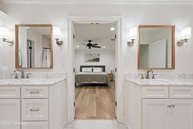 436 Brentwood Blvd, Lafayette, LA 70503 - ensuite bathroom featuring ceiling fan, two vanities, recessed lighting, and crown molding