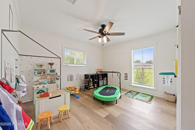 436 Brentwood Blvd, Lafayette, LA 70503 - playroom featuring ornamental molding, healthy amount of natural light, wood finished floors, a ceiling fan, and baseboards