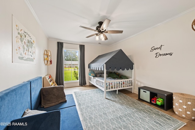 436 Brentwood Blvd, Lafayette, LA 70503 - bedroom with wood finished floors, crown molding, and a ceiling fan