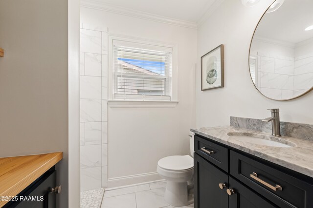436 Brentwood Blvd, Lafayette, LA 70503 - bathroom with vanity, toilet, ornamental molding, tiled shower, and marble look tile flooring