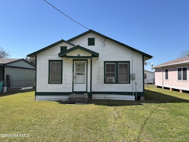 view of front of house featuring a front lawn and entry steps