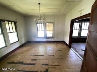 736 N Court St, Opelousas, LA 70570 - unfurnished dining area featuring plenty of natural light, a chandelier, brick patterned flooring, and baseboards