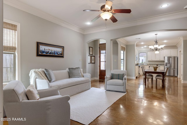 109 Barataria Bay, Lafayette, LA 70508 - living room featuring arched walkways, healthy amount of natural light, a chandelier, ceiling fan, and ornamental molding