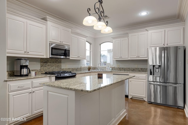109 Barataria Bay, Lafayette, LA 70508 - kitchen featuring stainless steel appliances, white cabinetry, a sink, decorative light fixtures, and ornamental molding