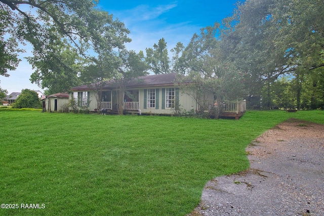 700 Guidry Rd, Lafayette, LA 70503 - ranch-style house with a front yard and covered porch