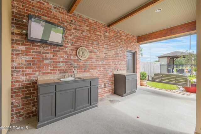 2311 Vida Shaw Rd, New Iberia, LA 70563 - view of patio / terrace with a sink and exterior kitchen
