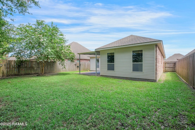 223 Moss Bluff Dr, Lafayette, LA 70507 - back of property with roof with shingles and a patio