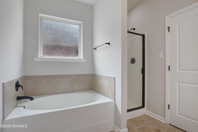 223 Moss Bluff Dr, Lafayette, LA 70507 - bathroom with a stall shower, a garden tub, and tile patterned flooring