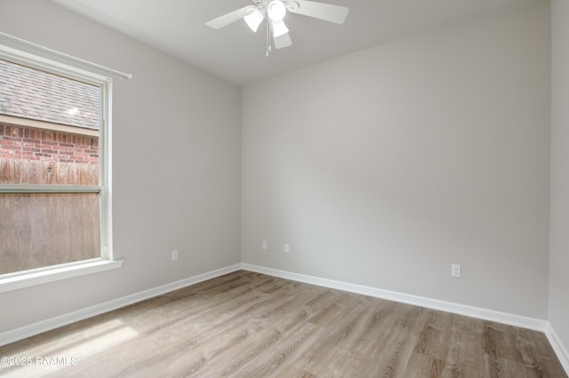 223 Moss Bluff Dr, Lafayette, LA 70507 - empty room with wood finished floors, ceiling fan, and baseboards