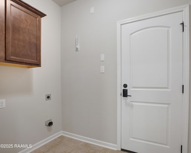 223 Moss Bluff Dr, Lafayette, LA 70507 - washroom with hookup for an electric dryer, cabinet space, baseboards, and light tile patterned flooring