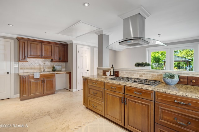 807 Cambridge Dr Res, Unit Res, Lafayette, LA 70503 - kitchen featuring stainless steel gas stovetop, island exhaust hood, tasteful backsplash, crown molding, and a sink