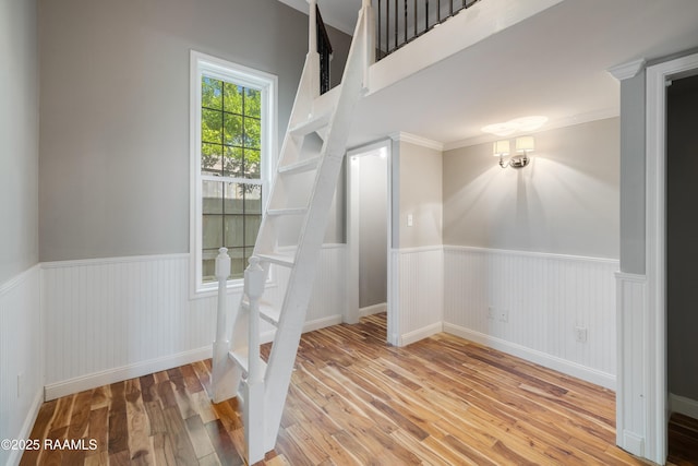 807 Cambridge Dr Res, Unit Res, Lafayette, LA 70503 - staircase with a wainscoted wall, hardwood / wood-style floors, and ornamental molding