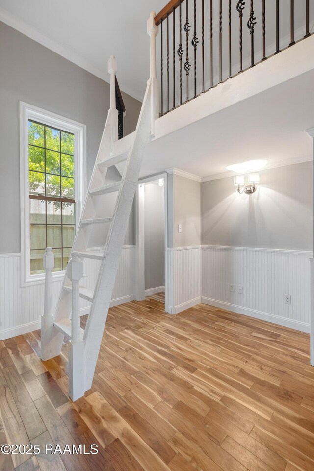 807 Cambridge Dr Res, Unit Res, Lafayette, LA 70503 - stairs featuring a wainscoted wall, hardwood / wood-style flooring, and ornamental molding