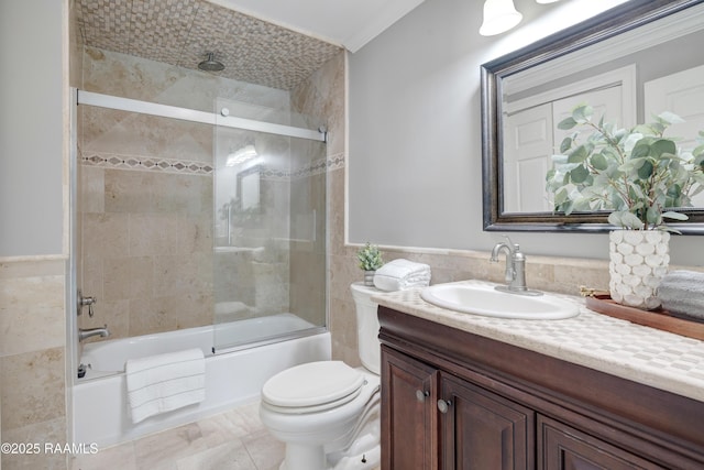 807 Cambridge Dr Res, Unit Res, Lafayette, LA 70503 - bathroom with vanity, tile walls, a combined bath / shower with rainfall shower, toilet, and crown molding