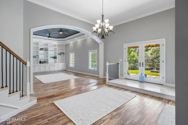 807 Cambridge Dr Res, Unit Res, Lafayette, LA 70503 - foyer featuring arched walkways, ornamental molding, wood finished floors, ceiling fan, and french doors