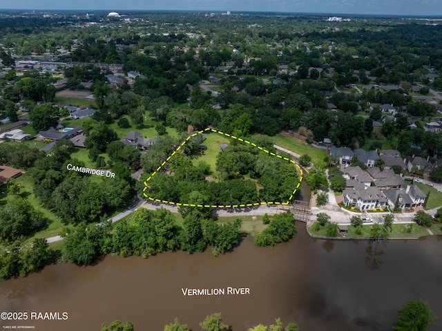 807 Cambridge Dr Res, Unit Res, Lafayette, LA 70503 - aerial view of residential area with a large body of water and property parcel outlined