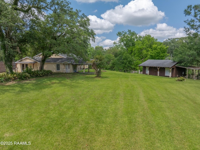 807 Cambridge Dr Res, Unit Res, Lafayette, LA 70503 - view of green lawn with an outdoor structure