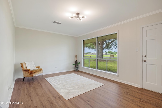 17639 Pelican Rd, Erath, LA 70533 - unfurnished room with crown molding, wood finished floors, baseboards, and a chandelier