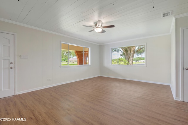 17639 Pelican Rd, Erath, LA 70533 - unfurnished room featuring healthy amount of natural light, wood finished floors, baseboards, a ceiling fan, and crown molding