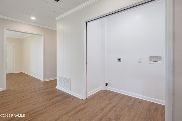 17639 Pelican Rd, Erath, LA 70533 - washroom with hookup for an electric dryer, washer hookup, light wood-style flooring, baseboards, and ornamental molding