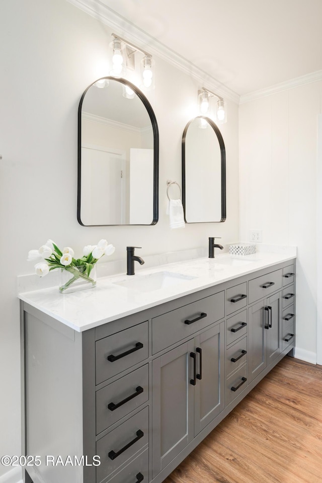 17639 Pelican Rd, Erath, LA 70533 - bathroom featuring ornamental molding, double vanity, and wood finished floors