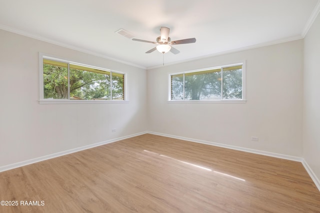 17639 Pelican Rd, Erath, LA 70533 - empty room with healthy amount of natural light, crown molding, light wood-type flooring, baseboards, and ceiling fan