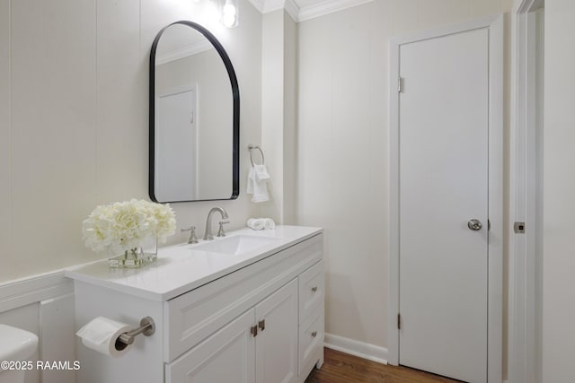 17639 Pelican Rd, Erath, LA 70533 - half bathroom with crown molding, vanity, wood finished floors, and toilet