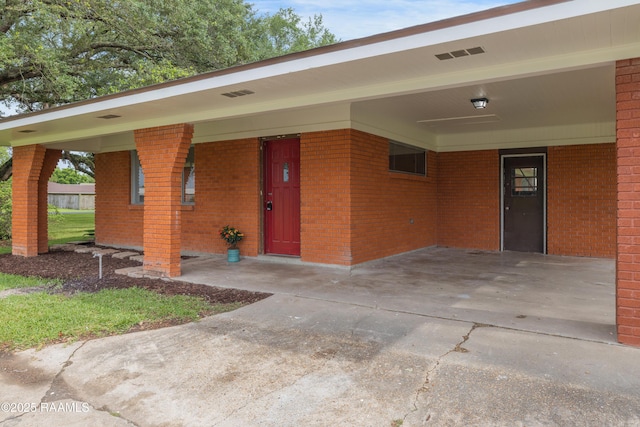 17639 Pelican Rd, Erath, LA 70533 - entrance to property featuring an attached carport and brick siding