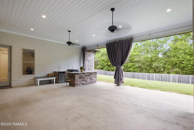 137 Grandview Terrace Dr, Youngsville, LA 70592 - view of patio featuring exterior kitchen, a ceiling fan, and a fenced backyard