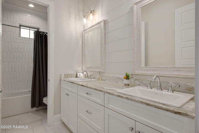 137 Grandview Terrace Dr, Youngsville, LA 70592 - bathroom featuring toilet, marble look tile flooring, double vanity, shower / bath combination with curtain, and baseboards