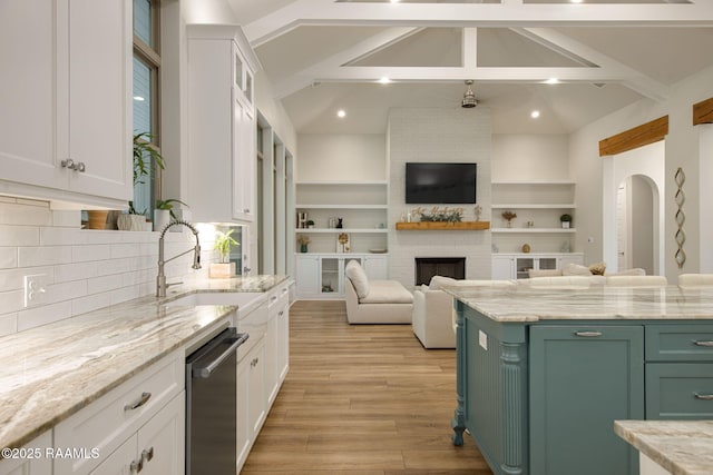 137 Grandview Terrace Dr, Youngsville, LA 70592 - kitchen featuring open floor plan, a sink, white cabinetry, stainless steel dishwasher, and light wood-style floors