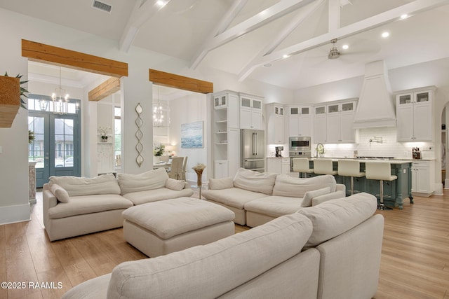 137 Grandview Terrace Dr, Youngsville, LA 70592 - living area with a chandelier, beamed ceiling, light wood-style flooring, high vaulted ceiling, and recessed lighting