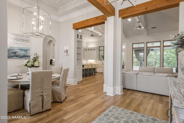 137 Grandview Terrace Dr, Youngsville, LA 70592 - dining area with beamed ceiling, arched walkways, light wood-style floors, baseboards, and ceiling fan