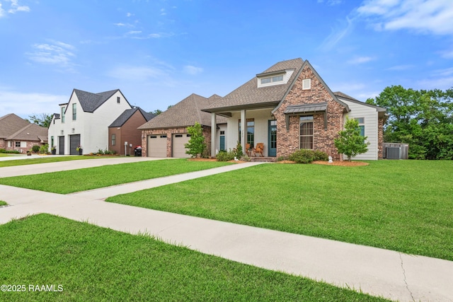 137 Grandview Terrace Dr, Youngsville, LA 70592 - view of front of house with driveway, brick siding, a front lawn, and an attached garage