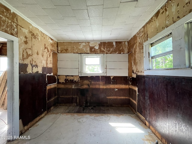 617 E Madison St, Opelousas, LA 70570 - kitchen featuring ornamental molding and wooden walls