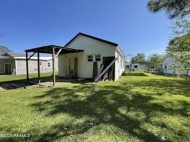 617 E Madison St, Opelousas, LA 70570 - back of property featuring a carport and entry steps