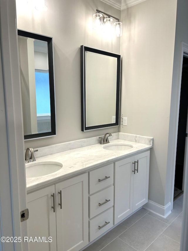 303 Bennington Ln, Youngsville, LA 70592 - full bath featuring tile patterned flooring, double vanity, and baseboards