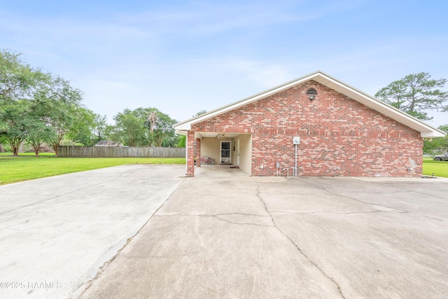 view of property exterior with brick siding