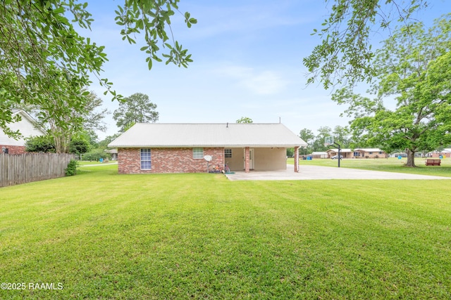 view of front of property with an attached carport and metal roof