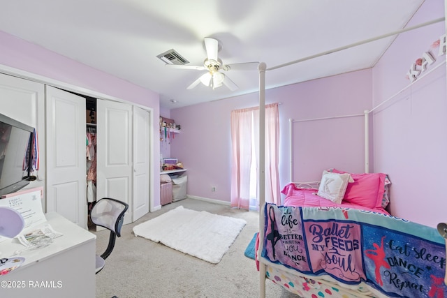 carpeted bedroom with a closet, a ceiling fan, and baseboards