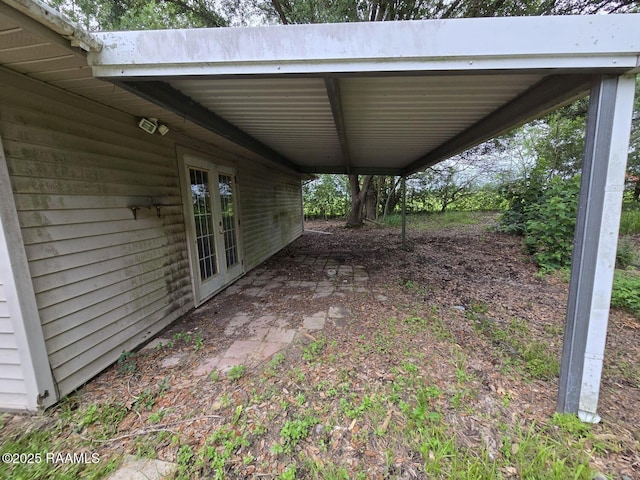 view of patio with french doors and an attached carport