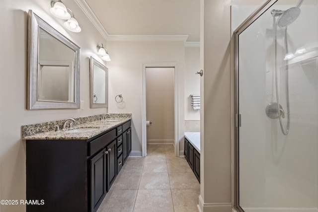 113 Gilmore Rd, Youngsville, LA 70592 - bathroom with ornamental molding, a stall shower, vanity, baseboards, and tile patterned flooring
